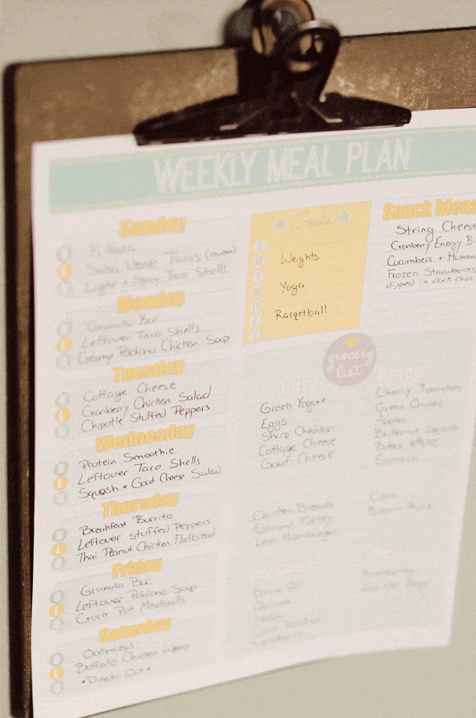 Free Printable Weekly Meal Planner hanging on clip board