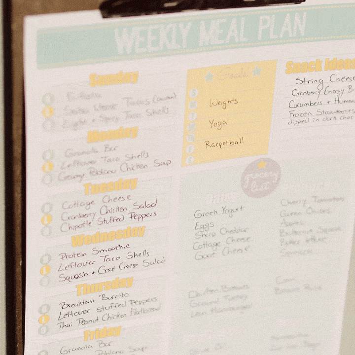 Free Printable Weekly Meal Planner hanging on clip board