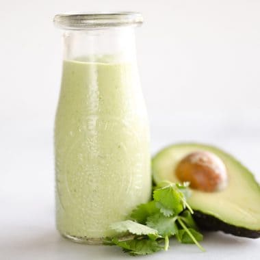 Avocado Lime Green Goddess Sauce is a light and healthy dressing made with creamy Greek yogurt, avocado, garlic and herbs. It is perfect on a salad or as a dipping sauce for chicken and steak!