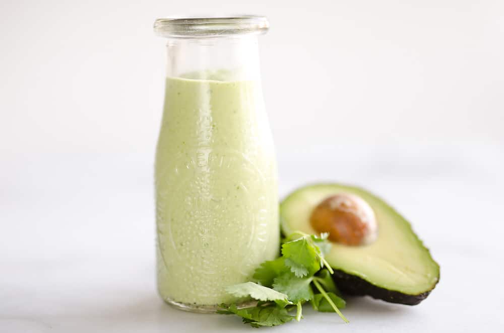 Avocado Lime Green Goddess Sauce is a light and healthy dressing made with creamy Greek yogurt, avocado, garlic and herbs. It is perfect on a salad or as a dipping sauce for chicken and steak!