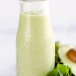Avocado Lime Green Goddess Sauce is a light and healthy dressing made with creamy Greek yogurt, avocado, garlic and herbs. It is perfect on a salad or as a dipping sauce for chicken and steak!