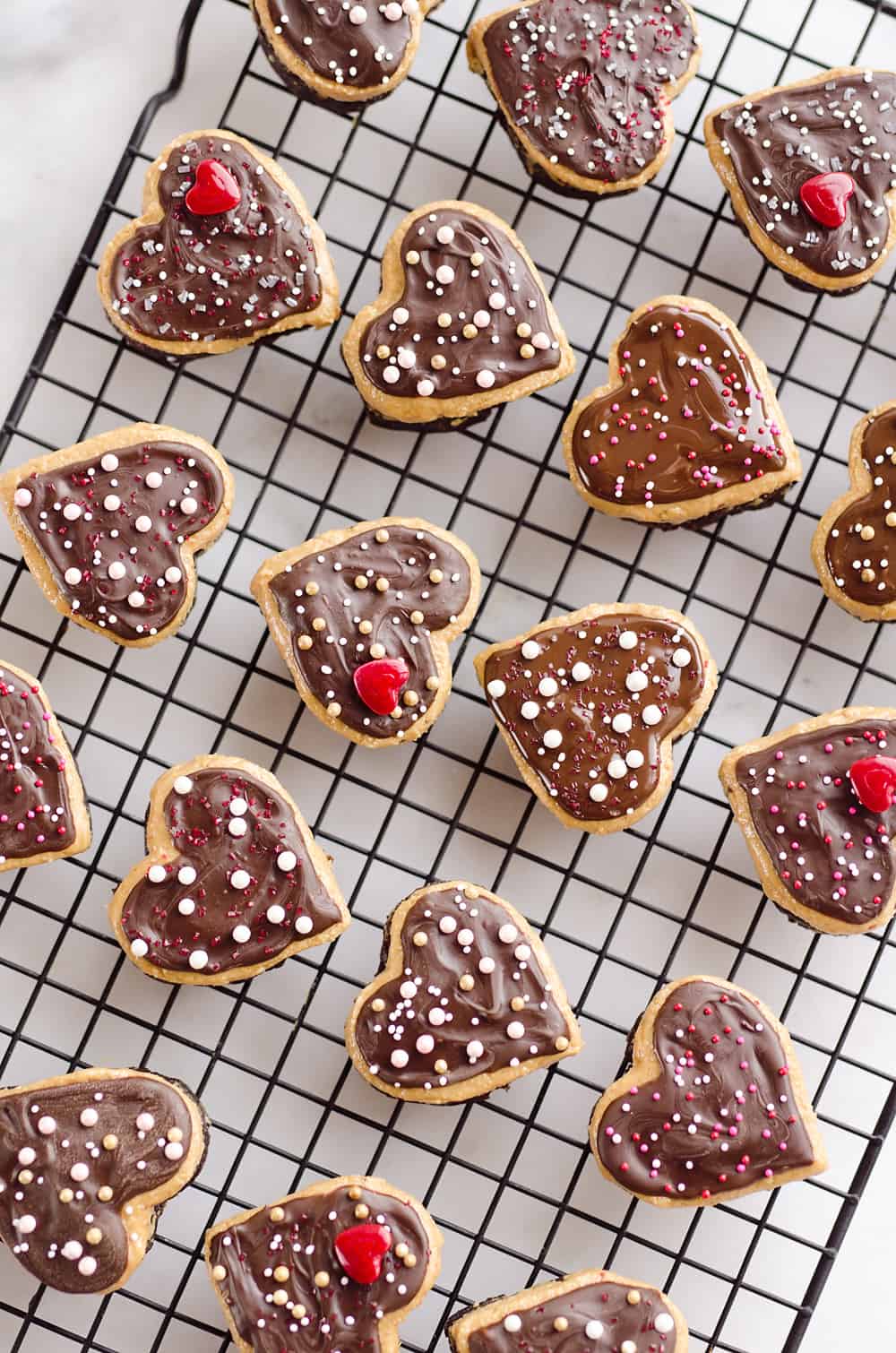 Peanut Butter Buckeye Brownie Hearts are the perfect sweet for your special Valentine. They combine two of the best desserts into one amazing treat with brownies and peanut butter buckeyes!