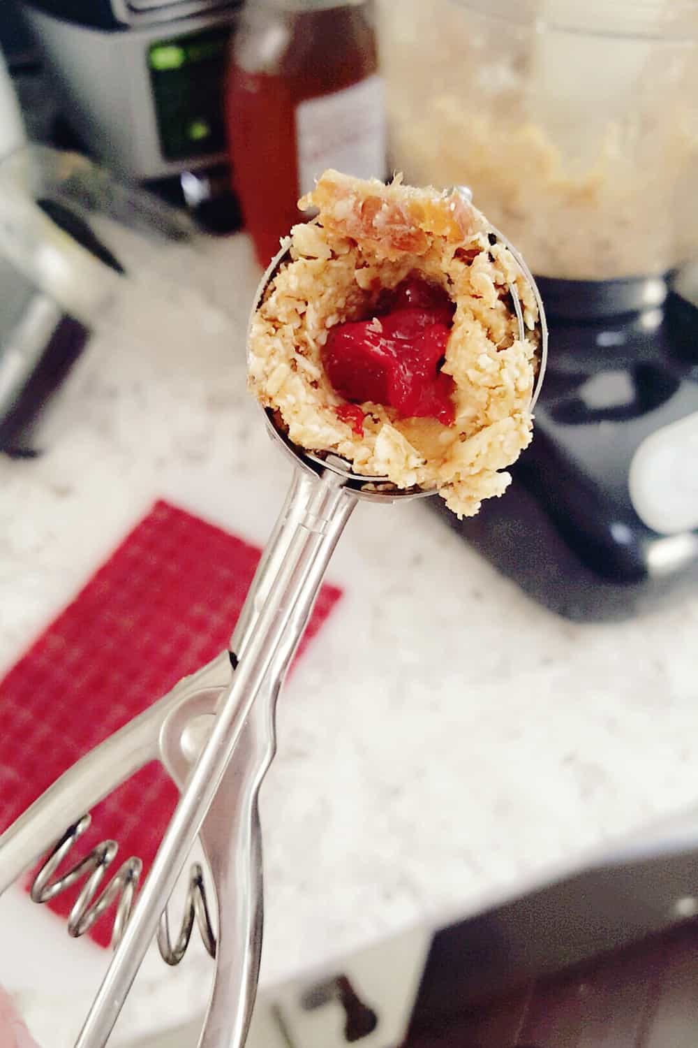 PB&J Surprise Energy Bites are a fun and healthy no bake snack with a peanut butter and oat mixture and a surprise pop of strawberry jelly on the inside. 