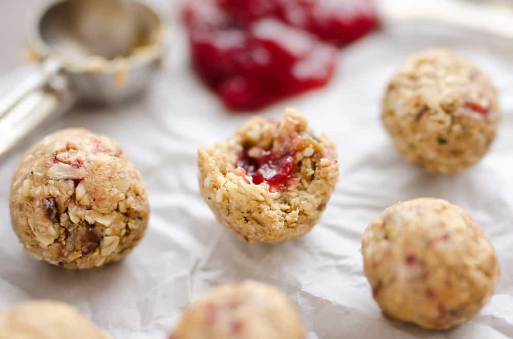 PB&J Surprise Energy Bites are a fun and healthy no bake snack with a peanut butter and oat mixture and a surprise pop of strawberry jelly on the inside. 