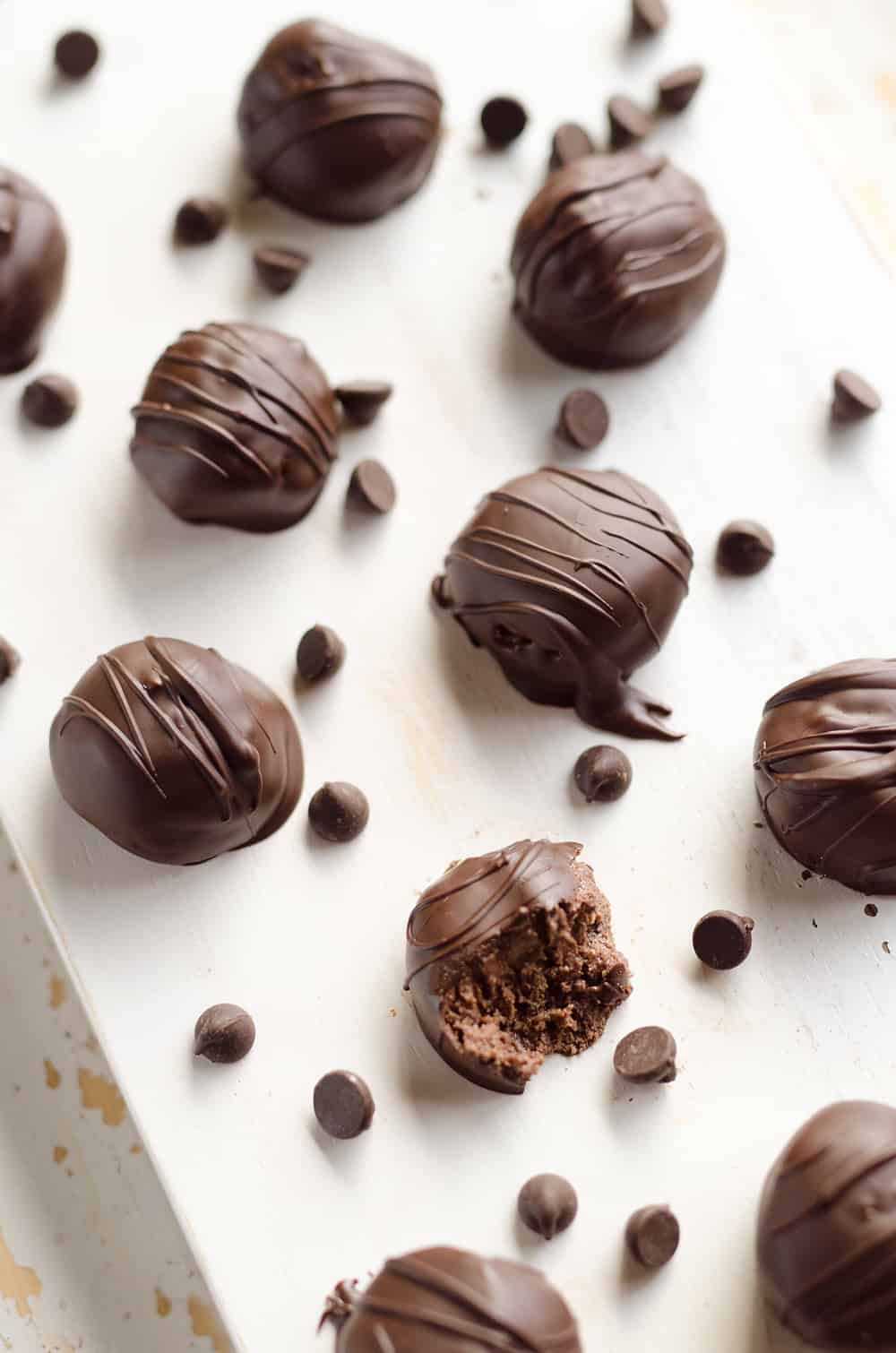 Protein Dark Chocolate Truffles are an easy and delicious treat made with protein powder and dark chocolate peanut butter for a healthy snack that tastes amazingly decadent!