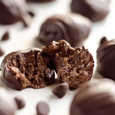 Protein Dark Chocolate Truffles are an easy and delicious treat made with protein powder and dark chocolate peanut butter for a healthy snack that tastes amazingly decadent!