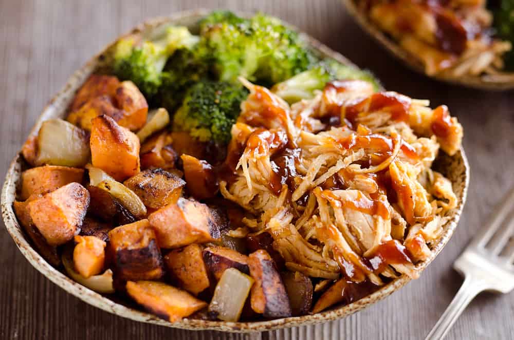 BBQ Chicken & Roasted Sweet Potato Bowls are a hearty and healthy dinner idea bursting with bold flavors and nutritious vegetables. This easy recipe is perfect for meal prepping lunches for work or a quick weeknight meal. 