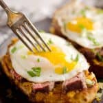 Breakfast Steak & Cheddar Toasts are a rich and decadent recipe filled with all the best parts of brunch. Tender steak is layered on top of a cheesy toast and topped with a sunny side up egg and scallions. 