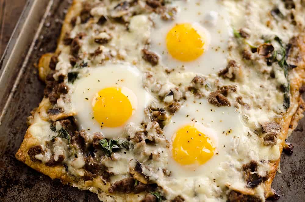 Turkey Sausage Breakfast Pizza is an easy recipe containing all of the best parts of breakfast! A flaky crescent crust is topped with a mixture of lean Jennie-O turkey sausage, vegetables, creamy Havarti cheese and soft baked eggs for a meal you won't soon forget. 