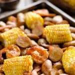 BBQ Shrimp & Sausage Sheet Pan Dinner is an easy and wholesome recipe perfect for a weeknight family dinner. Roasted sweet corn and potatoes are paired with BBQ shrimp and Gold'n Plump Hickory Smoked Sliced Chicken Sausage for a comforting low-fat meal!