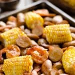 BBQ Shrimp & Sausage Sheet Pan Dinner is an easy and wholesome recipe perfect for a weeknight family dinner. Roasted sweet corn and potatoes are paired with BBQ shrimp and Gold'n Plump Hickory Smoked Sliced Chicken Sausage for a comforting low-fat meal!