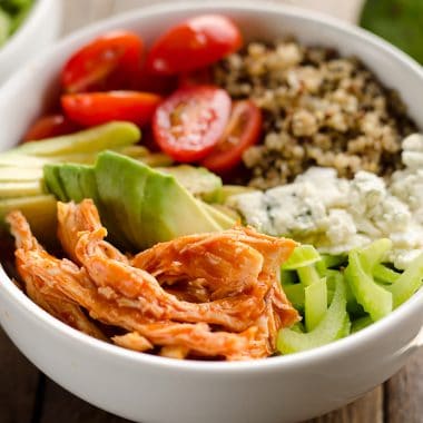 Buffalo Chicken & Quinoa Veggie Bowls are a light and healthy dinner recipe loaded with wholesome vegetables and grains, shredded chicken tossed in spicy buffalo sauce and bleu cheese crumbles for amazing flavor!