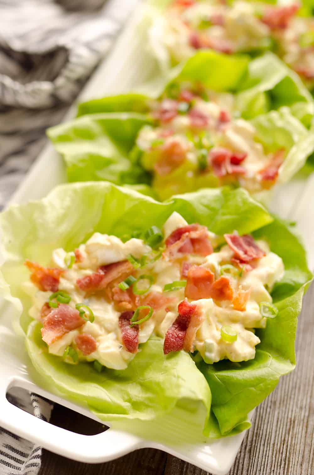 Light Bacon Egg Salad Lettuce Cups are an easy and healthy low-carb lunch idea made with Greek yogurt and topped with crispy bacon for amazing flavor!