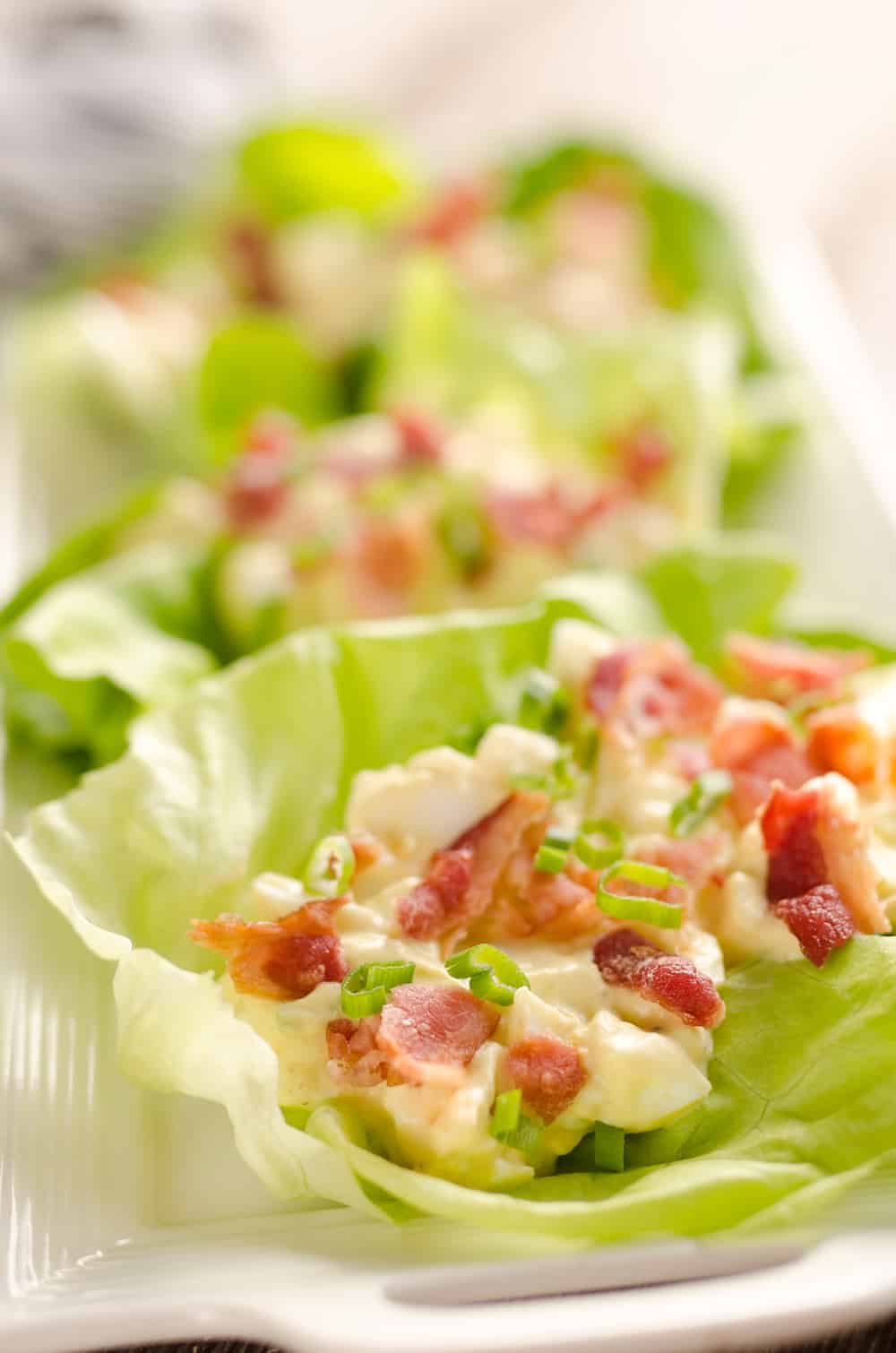 Light Bacon Egg Salad Lettuce Cups are an easy and healthy low-carb lunch idea made with Greek yogurt and topped with crispy bacon for amazing flavor!