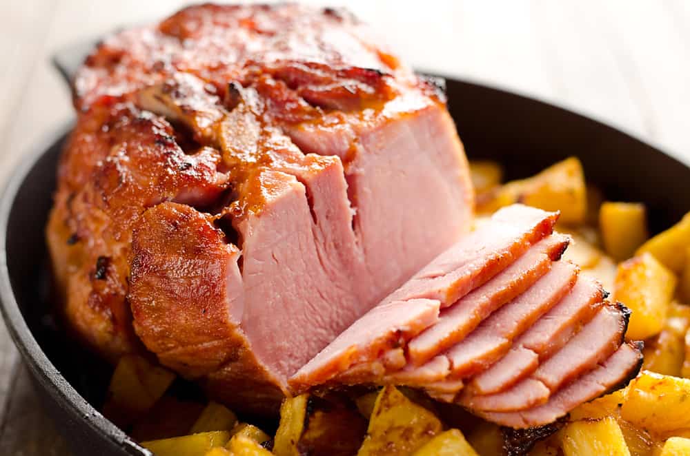 Roasted Pineapple & Chipotle Honey Ham is a sweet and spicy twist on your traditional holiday meal. This easy recipe is finished off with fresh pineapple roasted to sweet perfection for a perfect compliment to the salty and smoky ham. 