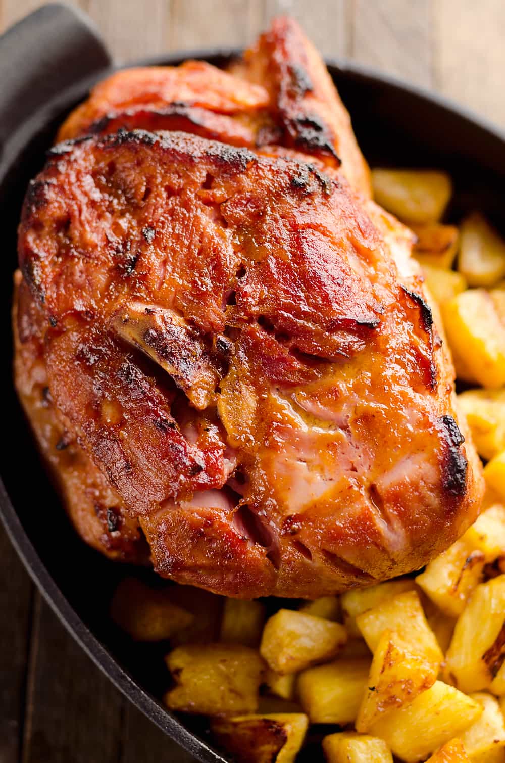 Roasted Pineapple & Chipotle Honey Ham is a sweet and spicy twist on your traditional holiday meal. This easy recipe is finished off with fresh pineapple roasted to sweet perfection for a perfect compliment to the salty and smoky ham. 