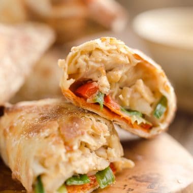 Airfryer Baked Thai Peanut Chicken Egg Rolls are a light and healthy recipe made in your Airfryer or oven. Chicken is tossed with creamy Thai peanut sauce, carrots, red peppers and green onions and rolled in crispy egg roll wrappers for a flavorful dinner you can make in just 20 minutes.