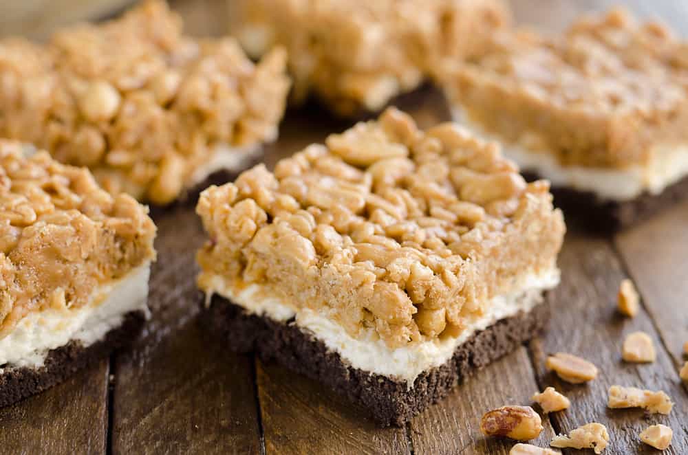 Crunchy Peanut Butter Marshmallow Bars are a sweet and salty dessert everyone will love! A chocolate crust is topped with marshmallows and a crunchy peanut butter and rice crispie mixture for a delicious treat. 