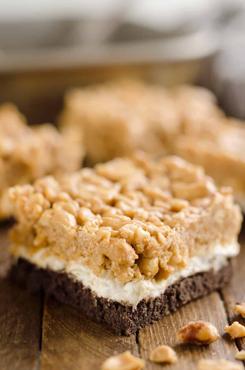 Crunchy Peanut Butter Marshmallow Bars are a sweet and salty dessert everyone will love! A chocolate crust is topped with marshmallows and a crunchy peanut butter and rice crispie mixture for a delicious treat. 