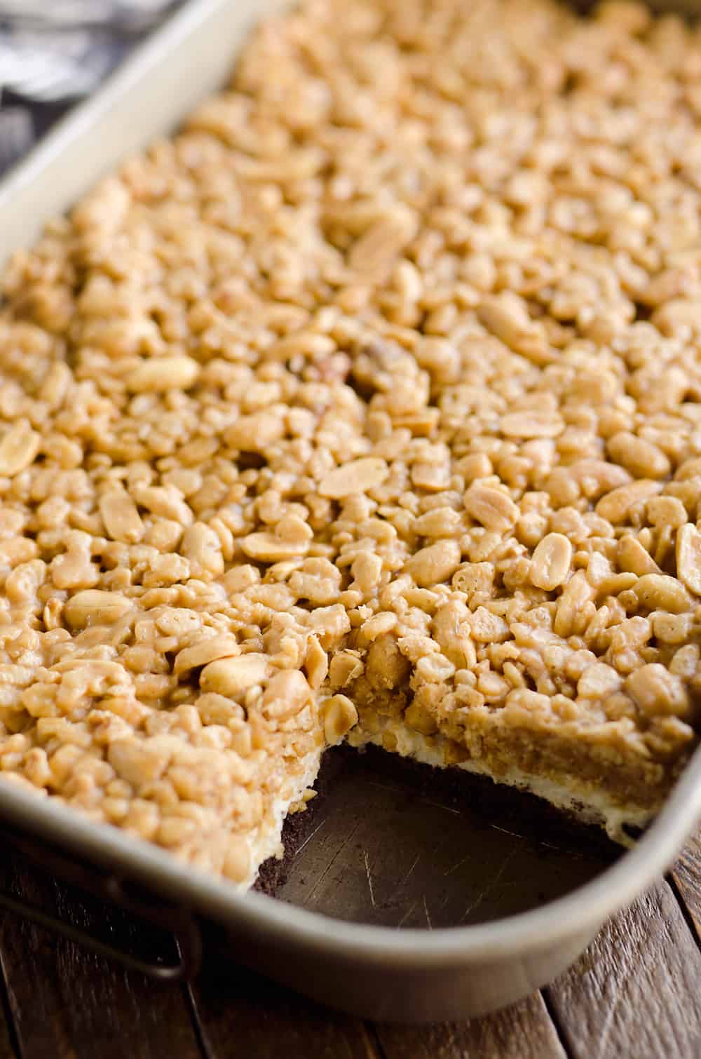 Crunchy Peanut Butter Marshmallow Bars are a sweet and salty dessert everyone will love! A chocolate crust is topped with marshmallows and a crunchy peanut butter and rice crispie mixture for a delicious treat. 