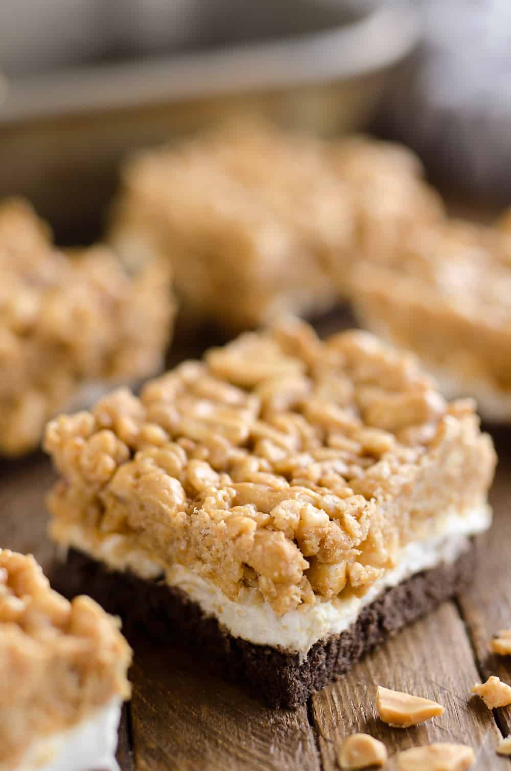 Crunchy Peanut Butter Marshmallow Bars are a sweet and salty dessert everyone will love! A chocolate crust is topped with marshmallows and a crunchy peanut butter and rice crispie mixture for a delicious treat. 