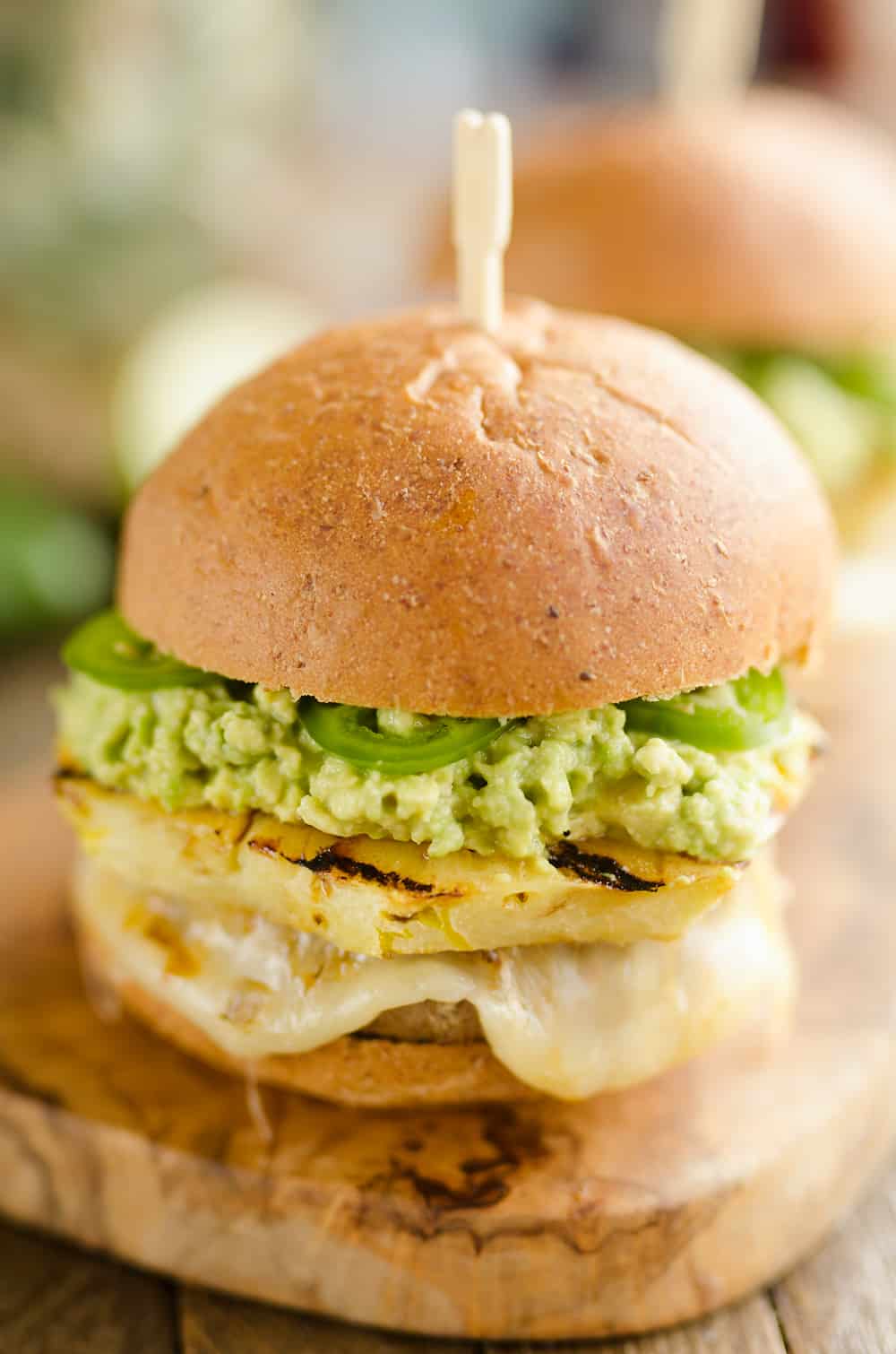 Grilled Pineapple & Guacamole Turkey Burger is a healthy and easy recipe made on the grill! Juicy Jennie-O Turkey Burgers are topped with pepperjack cheese, sweet grilled pineapple, guacamole and fresh jalapeños for a zesty burger perfect for any grill out. 