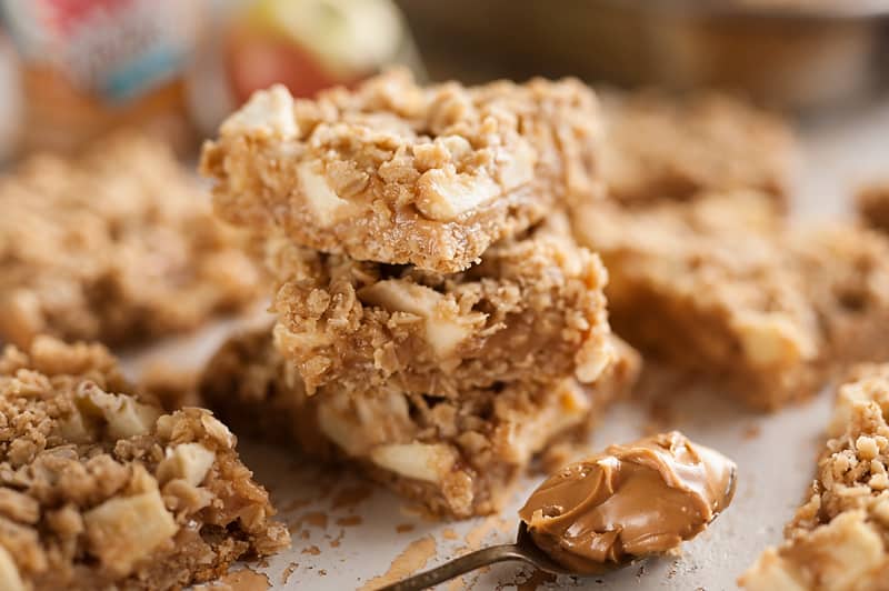 Peanut Butter Apple Oatmeal Bars with spoonful of peanut butter