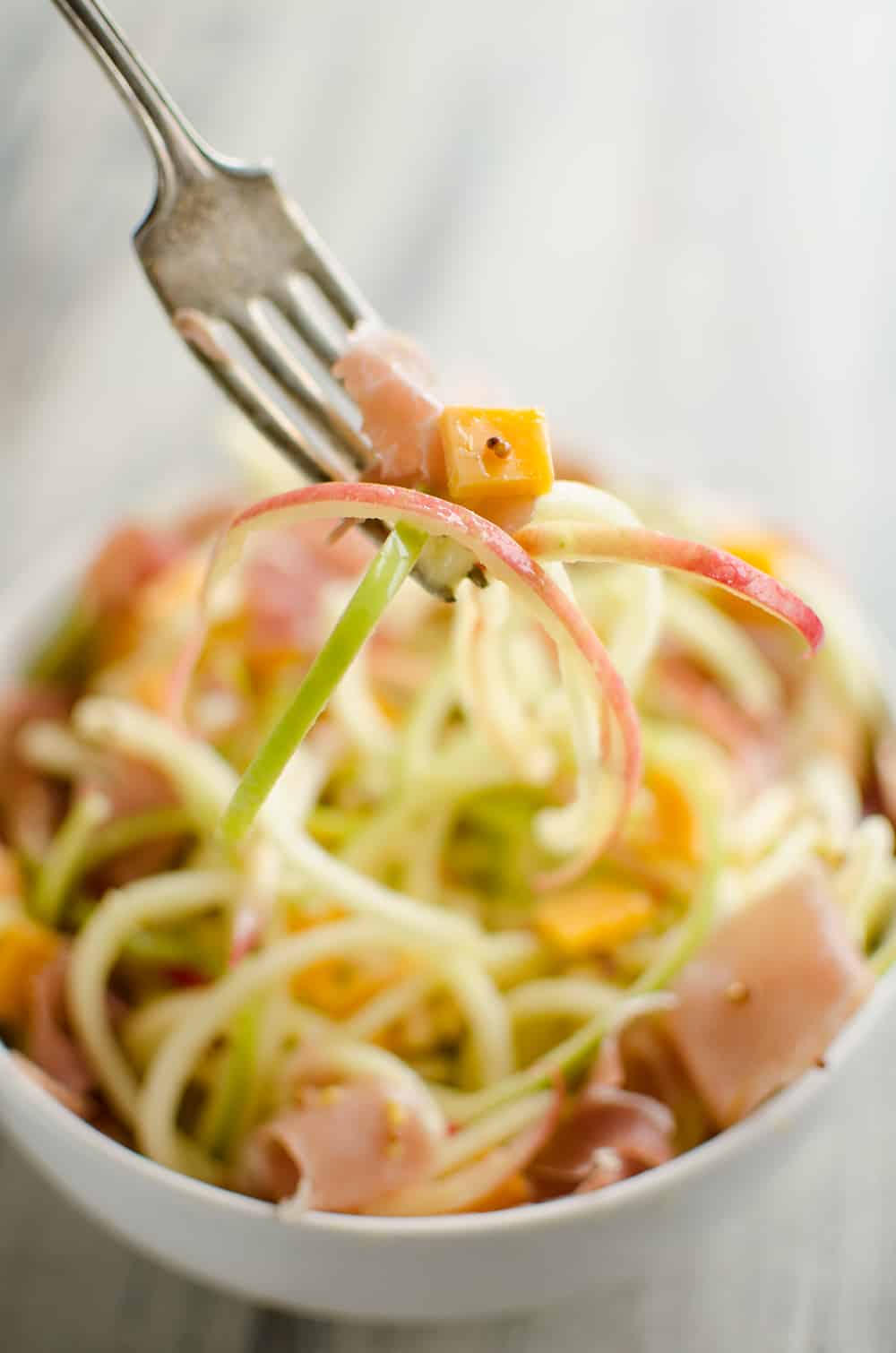 Spiralized Apple, Cheddar & Prosciutto Salad with fork