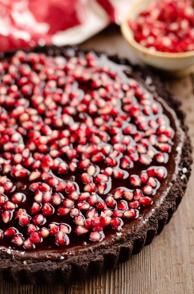 dark chocolate tart topped with pomegranates