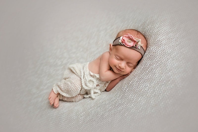 newborn baby smiling girl photograph