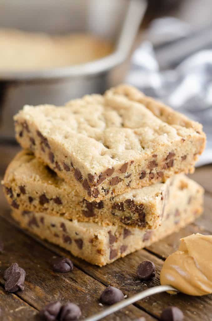 Peanut Butter Chocolate Chip Cookie Bars with spoonful of peanut butter