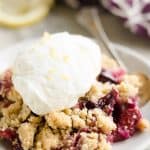 Lemon Berry Crisp topped with lemon whipped cream