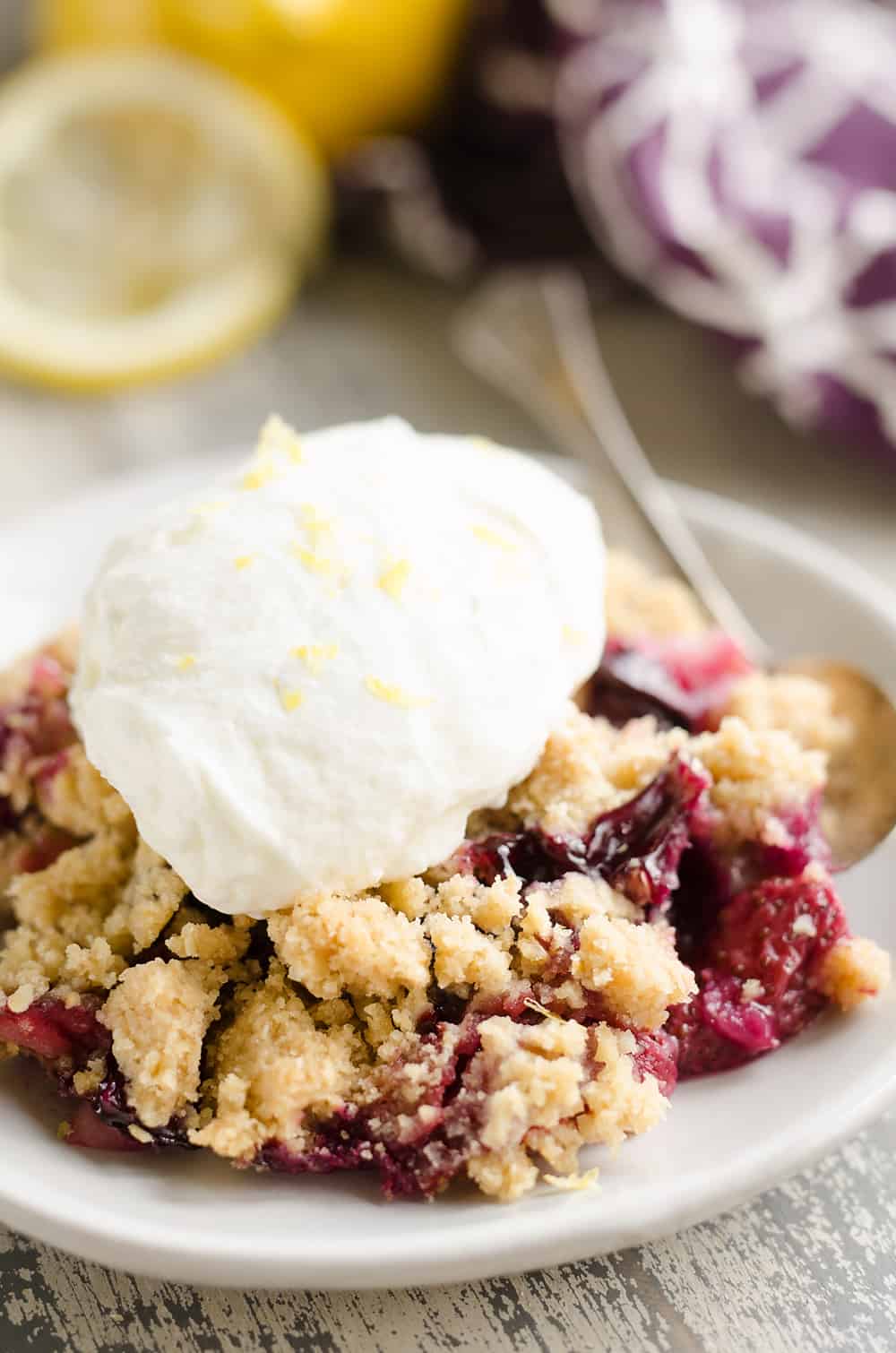 Lemon Berry Crisp topped with lemon whipped cream