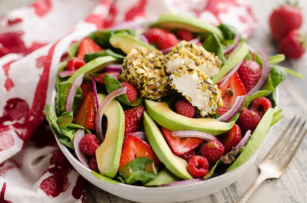 Pistachio Crusted Goat Cheese Berry Salad in large bowl