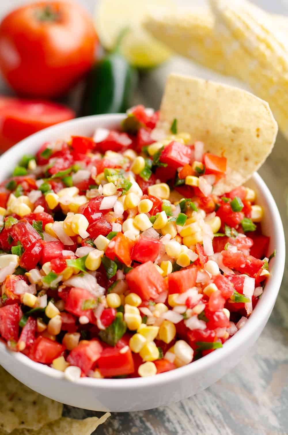 Garden Fresh Sweet Corn Salsa in bowl with chip dipping