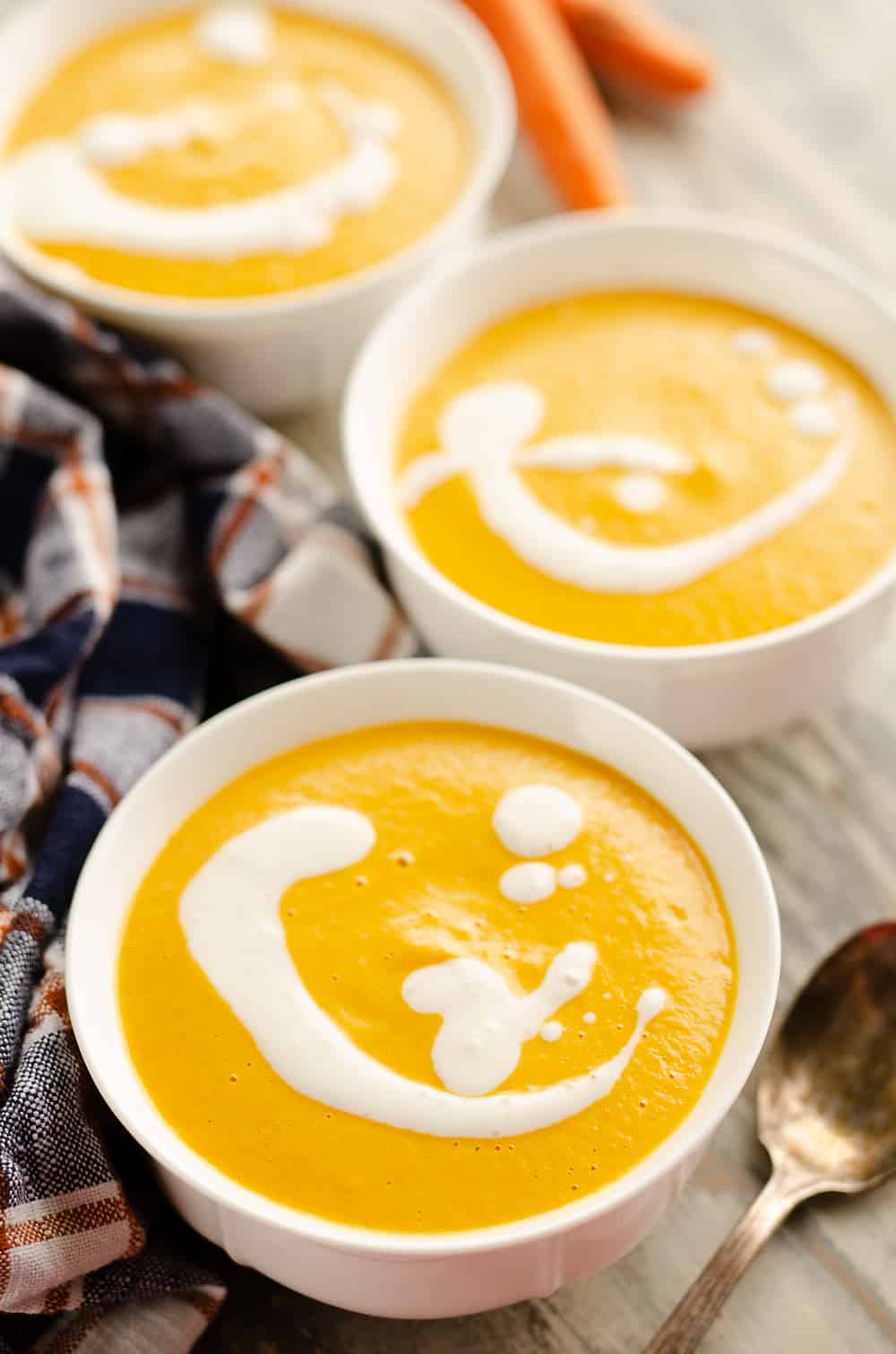 Pressure Cooker Creamy Carrot Soup in three bowls