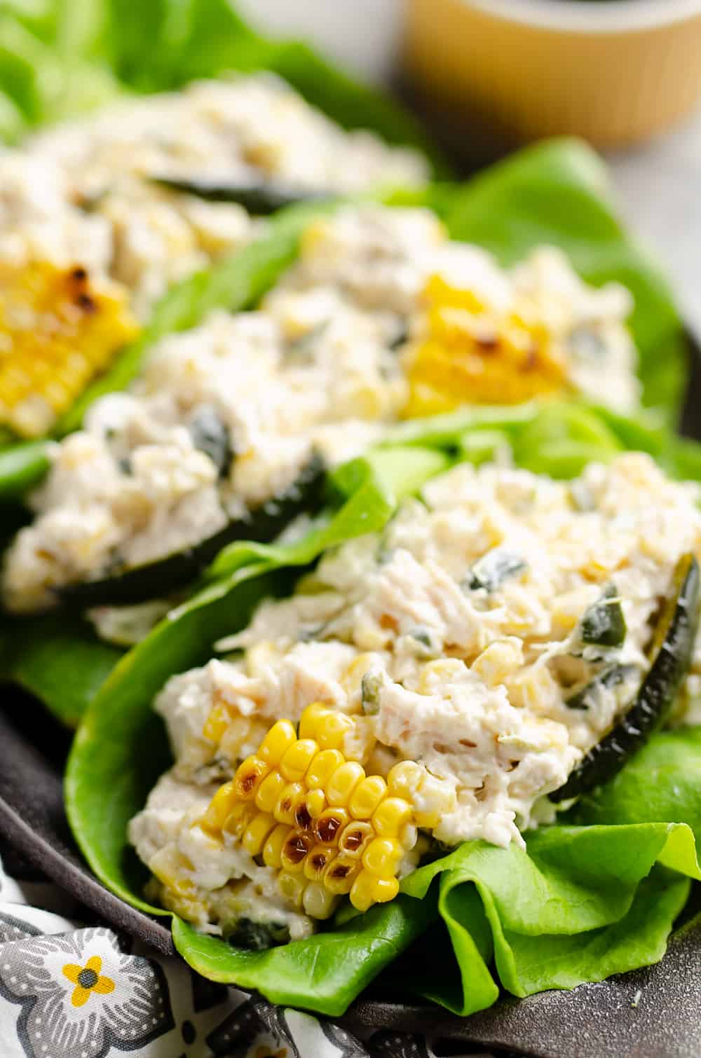Roasted Poblano & Sweet Corn Chicken Salad served in lettuce cups