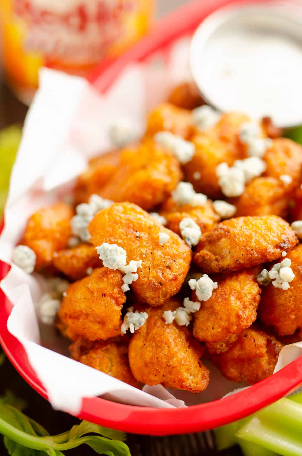 Airfryer Buffalo Cauliflower Tots in basket with bleu cheese