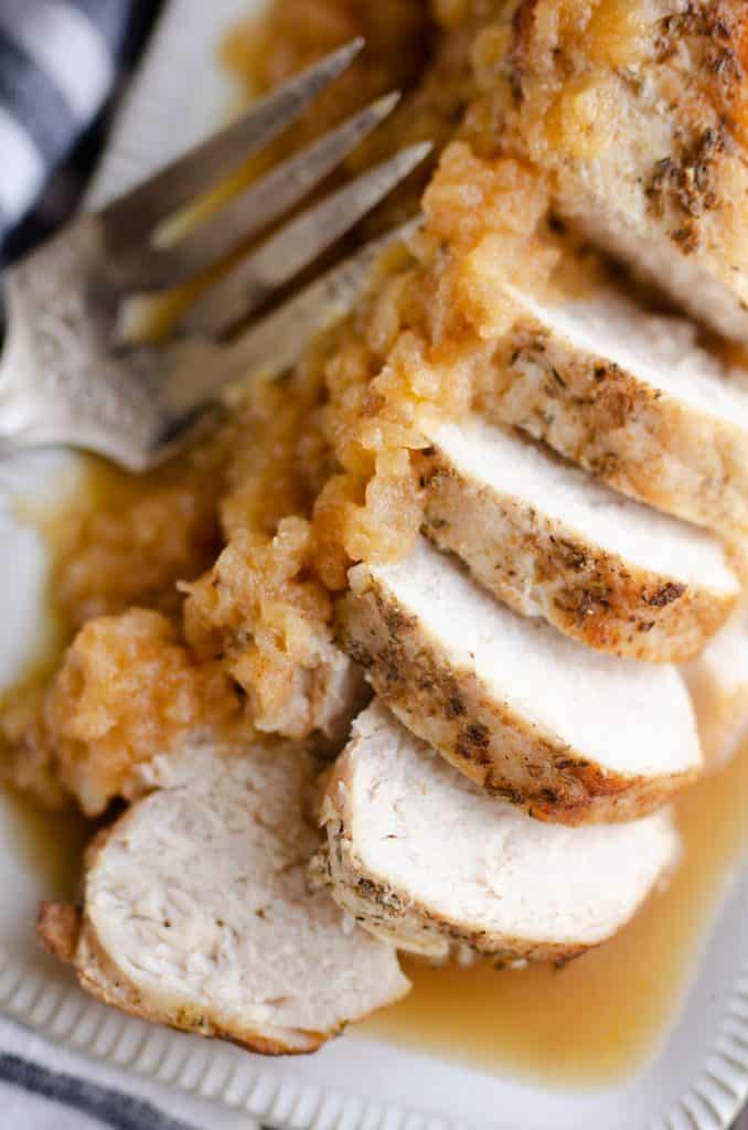Pressure Cooker Pork Loin with Bourbon Apple Sauce in Instant Pot served with fork