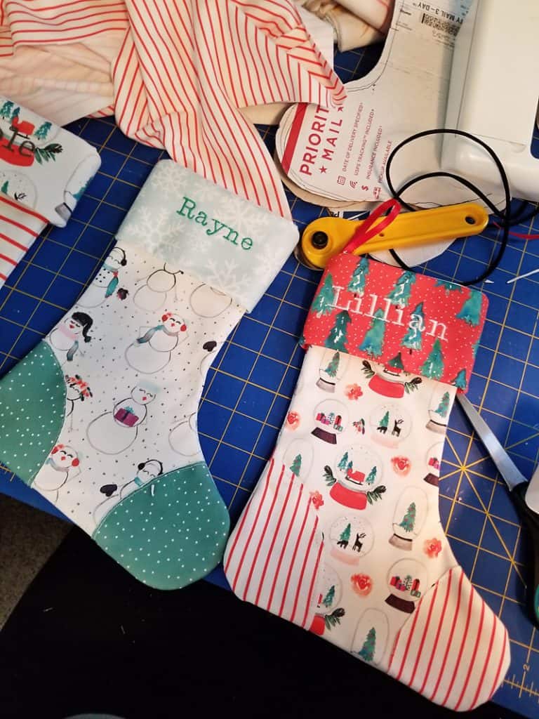 homemade personalized Christmas stockings on cutting mat