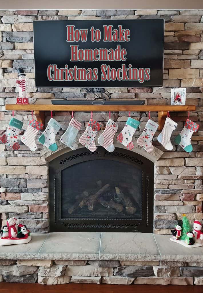 homemade personalized Christmas stockings hanging on fireplace mantel