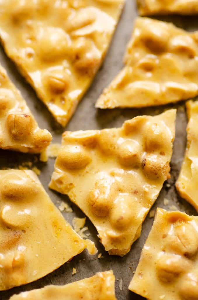 Microwave peanut brittle broken up on sheet pan