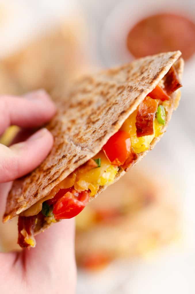 Turkey Bacon Breakfast Quesadilla held in hand