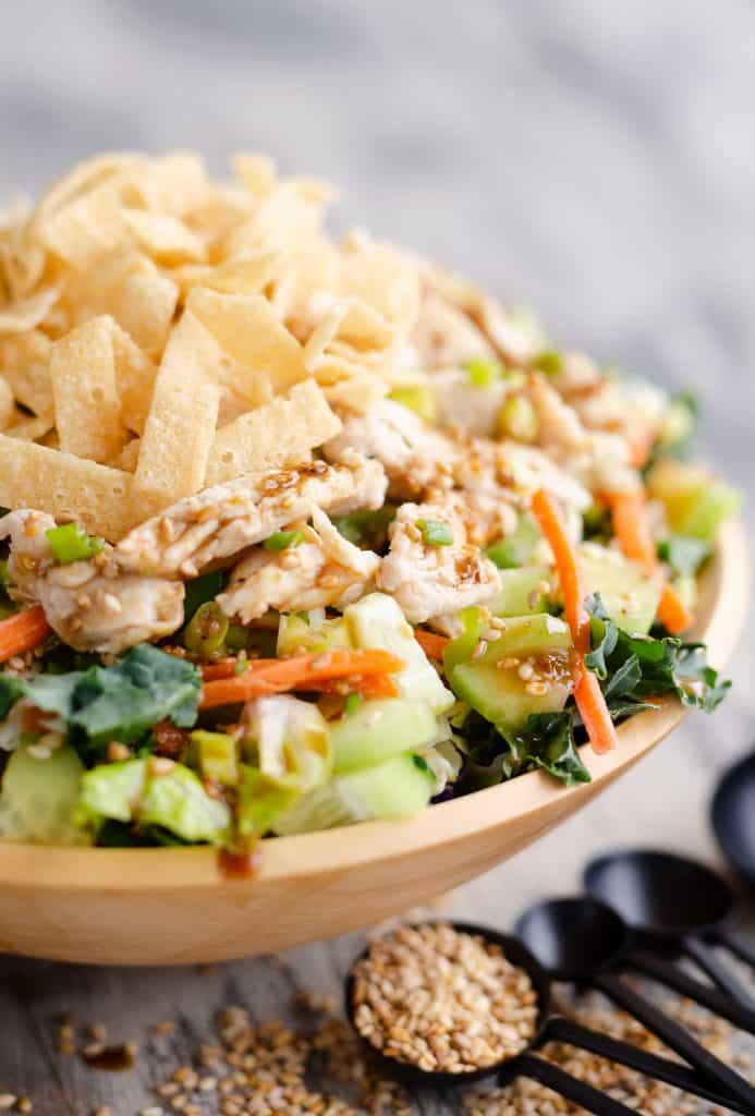 Asian Toasted Sesame Chicken Salad in homemade wooden bowl