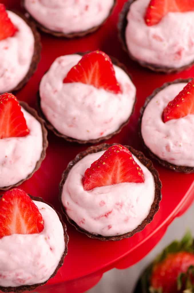 Strawberry Dark Chocolate Dessert Cups on red cake stand