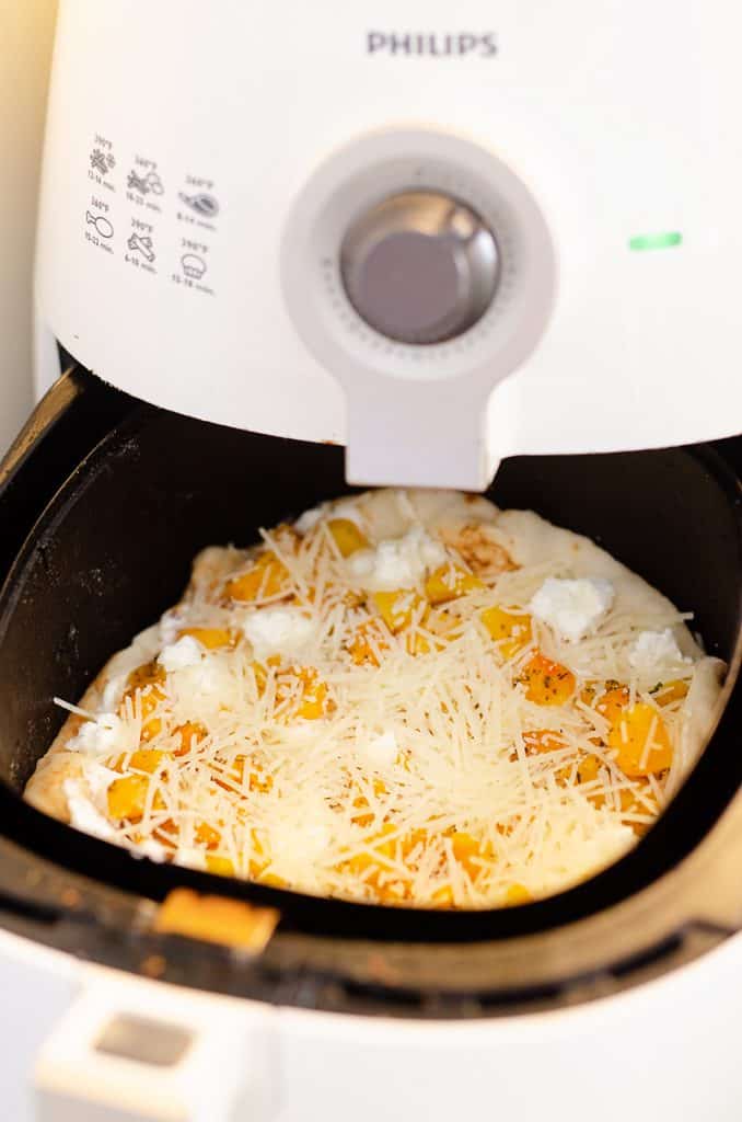 Airfryer Squash & Goat Cheese Pizza baking in air fryer