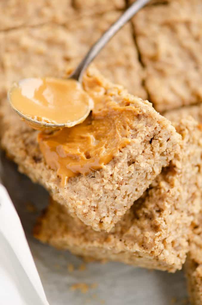 Kids No Sugar Peanut Butter Banana Oatmeal Bars topped with peanut butter