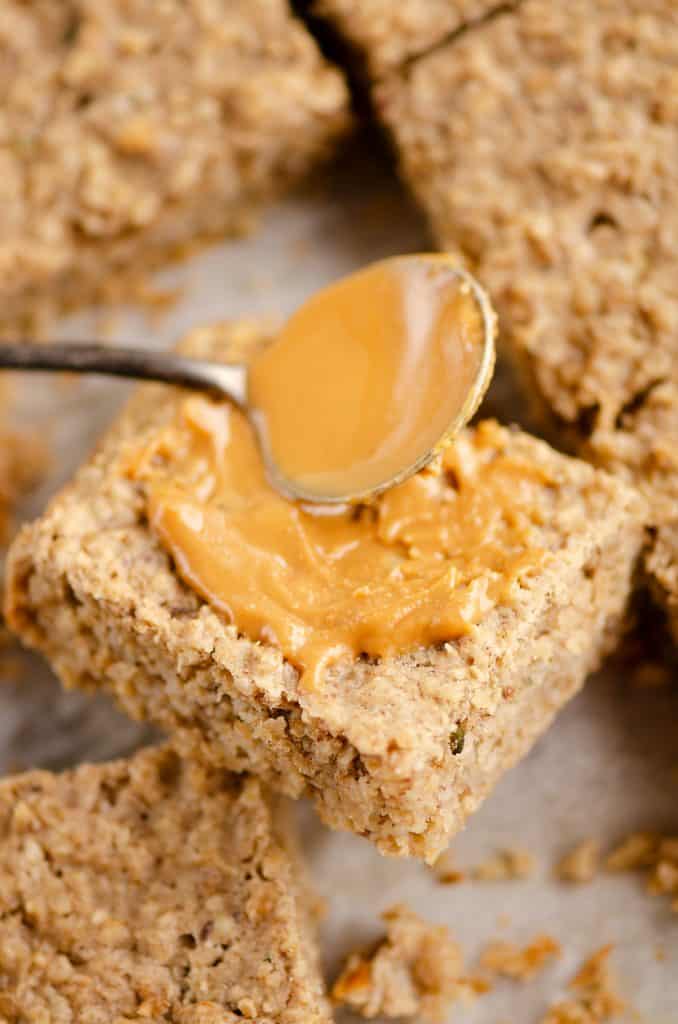 Kids No Sugar Peanut Butter Banana Oatmeal Bars spread with peanut butter