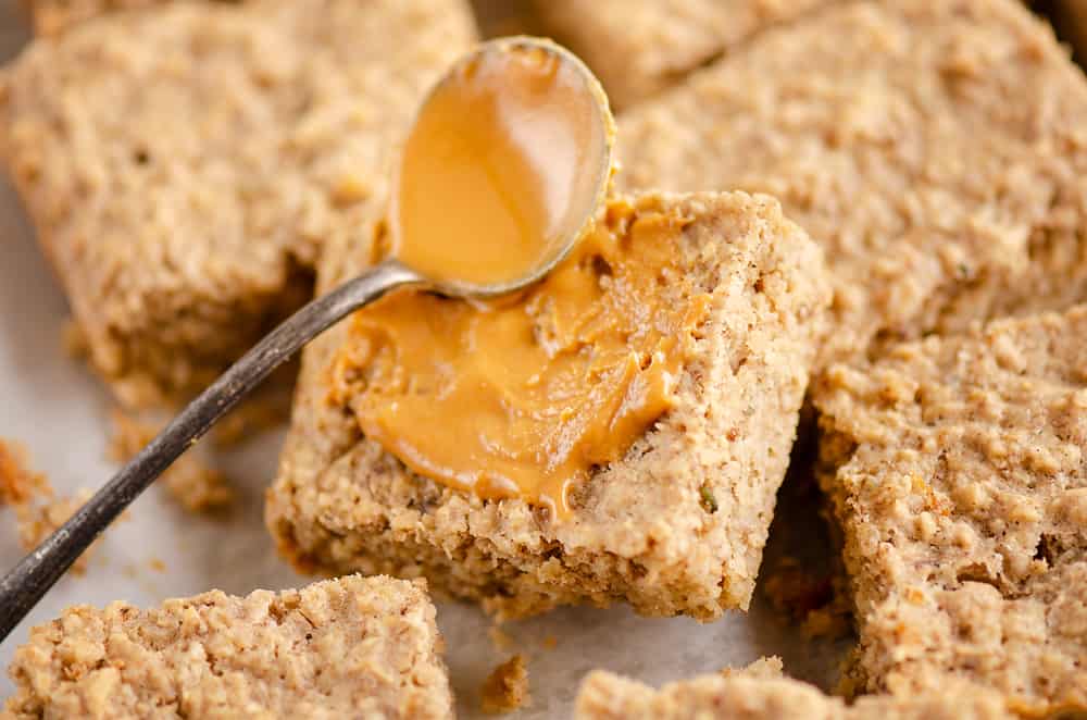 Kids No Sugar Peanut Butter Banana Oatmeal Bars spread with peanut butter