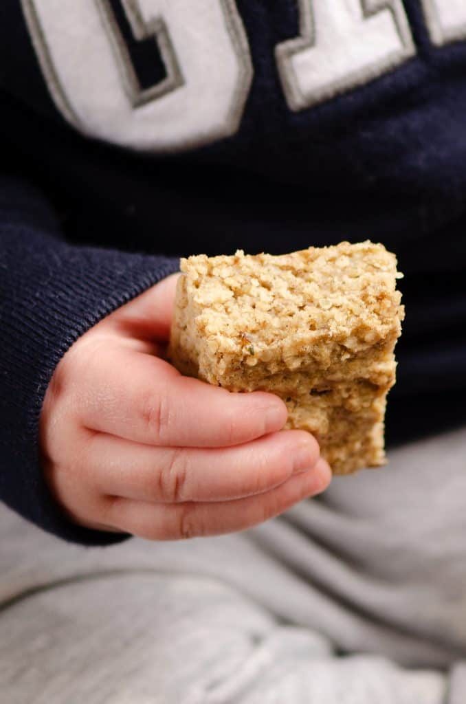 child holding Kids No Sugar Peanut Butter Banana Oatmeal Bars